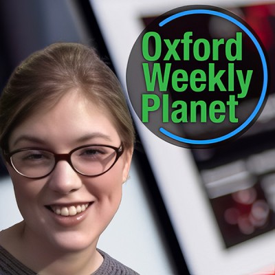 Smiling woman with blonde hair pulled back and glasses alongside the Oxford Weekly Planet logo